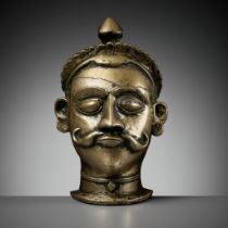 A BRASS LINGAM COVER WITH THE HEAD OF SHIVA, MAHARASHTRA, 18TH - 19TH CENTURY