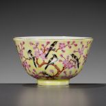 A YELLOW GROUND FAMILLE ROSE 'MAGPIE AND PRUNUS' CUP, XIANFENG MARK AND POSSIBLY OF THE PERIOD