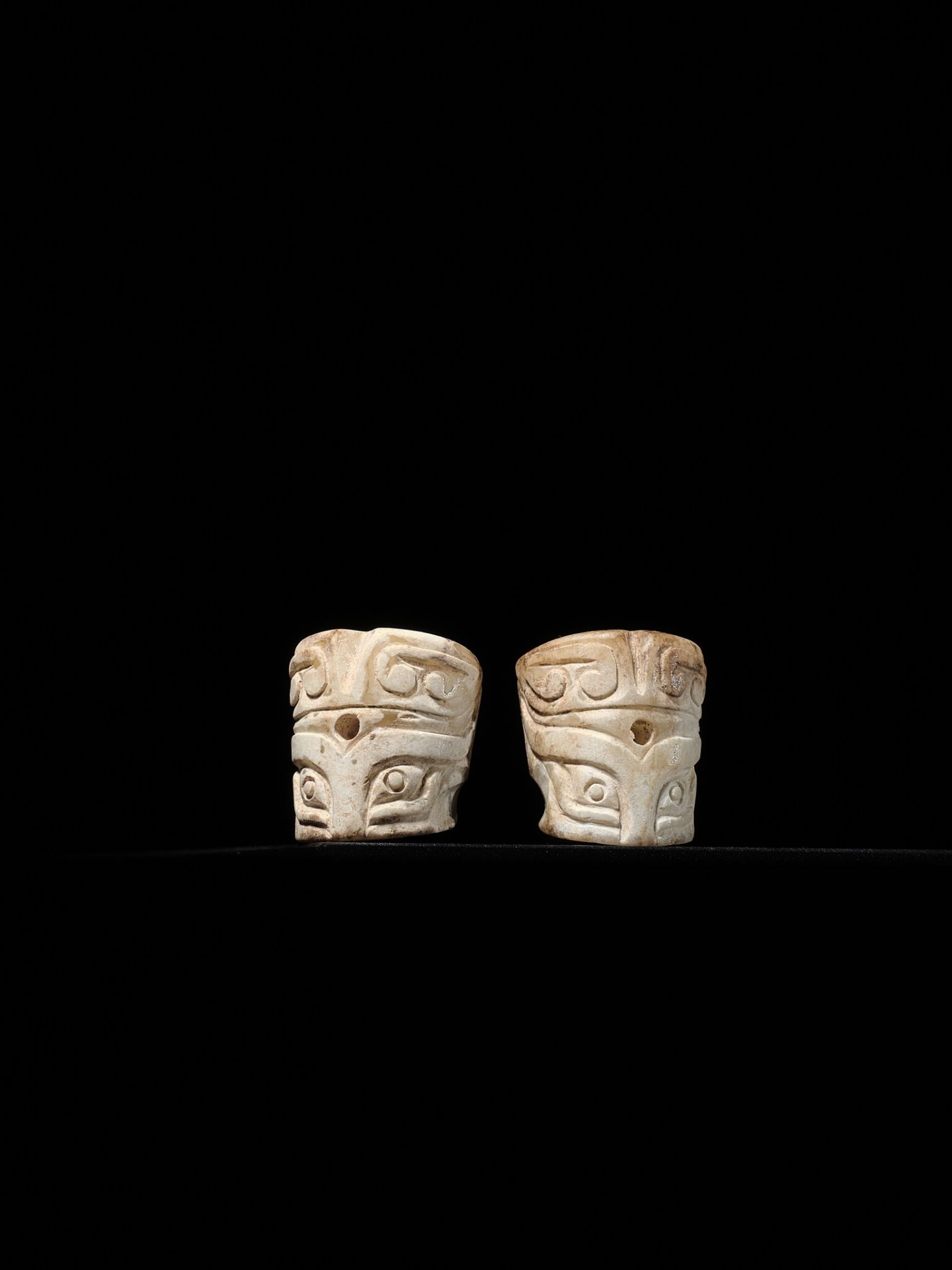 A PAIR OF CYLINDRICAL 'TAOTIE MASK' JADE BEADS, SHANG DYNASTY - Image 2 of 13