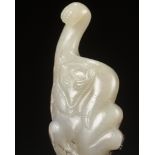 AN ARCHAISTIC WHITE JADE 'BEAR' GARMENT HOOK, QING DYNASTY