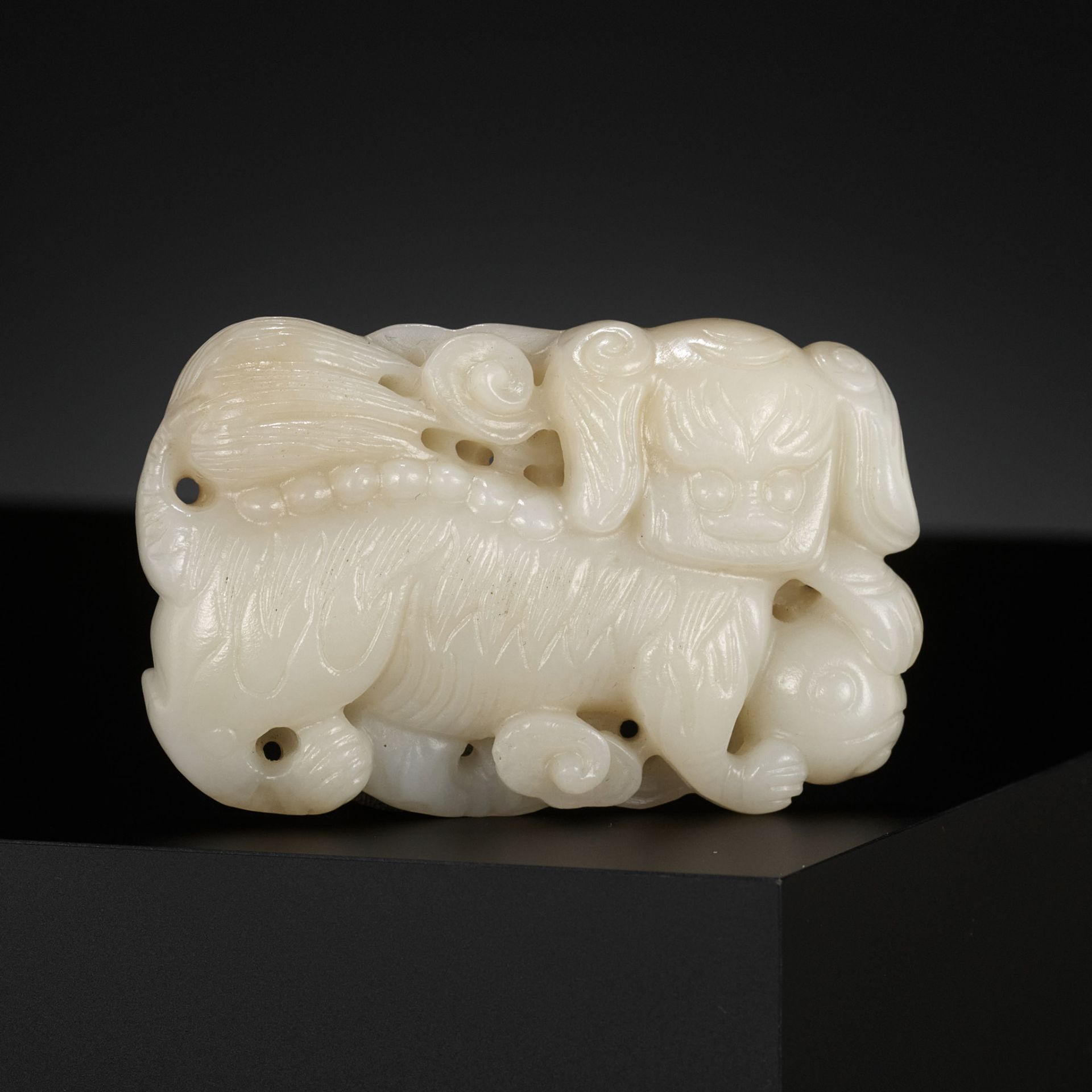 A WHITE JADE 'BUDDHIST LION' BELT BUCKLE, CHINA, 18TH CENTURY