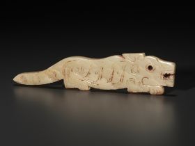A YELLOW JADE 'TIGER' PENDANT, LATE SHANG TO WESTERN ZHOU DYNASTY