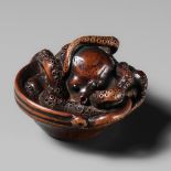 MASATOMO: A SUPERB NAGOYA SCHOOL WOOD NETSUKE OF AN OCTOPUS IN SURIBACHI