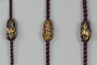 A GROUP OF THREE MIXED METAL OJIME DEPICTING FLOWERS