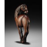 A SUPERB AND LARGE WOOD NETSUKE OF A HORSE