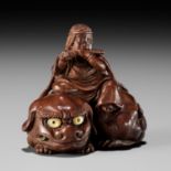 KEIKOKU: A VERY FINE INLAID WOOD NETSUKE OF MONJU BOSATSU