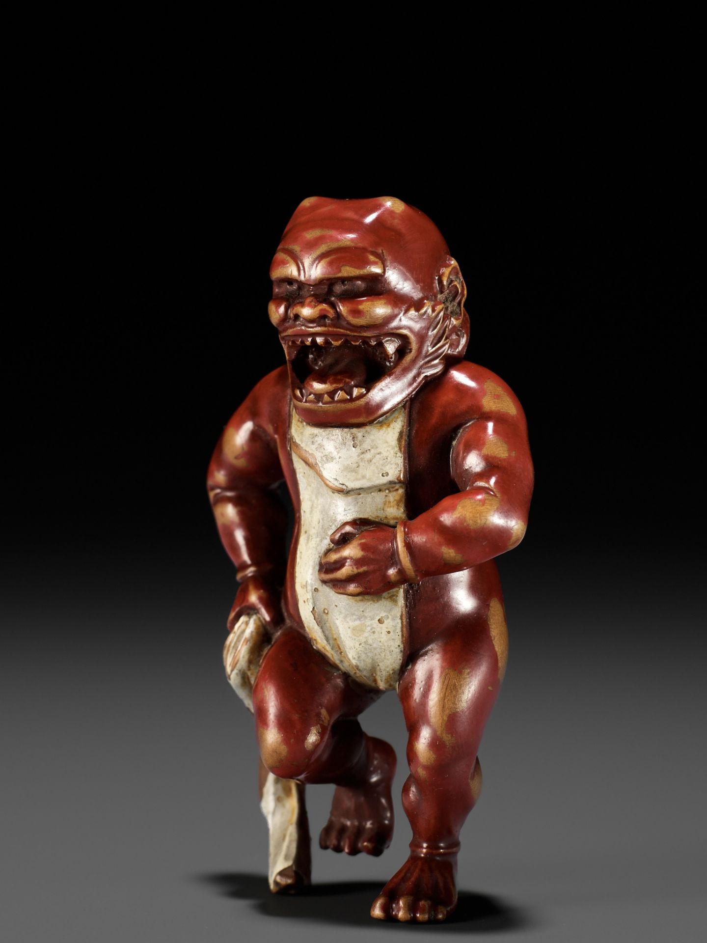 A RARE LACQUERED WOOD NETSUKE OF AN ONI TYING HIS FUNDOSHI - Image 4 of 12