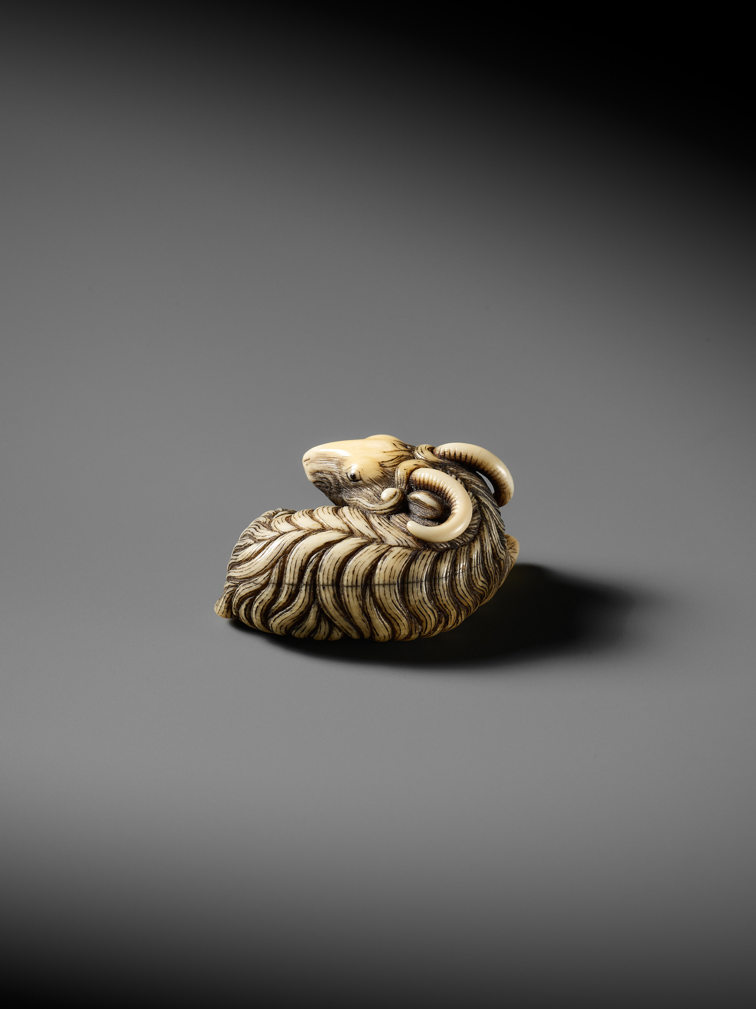 A FINE MARINE IVORY NETSUKE OF A RECLINING GOAT - Image 4 of 12