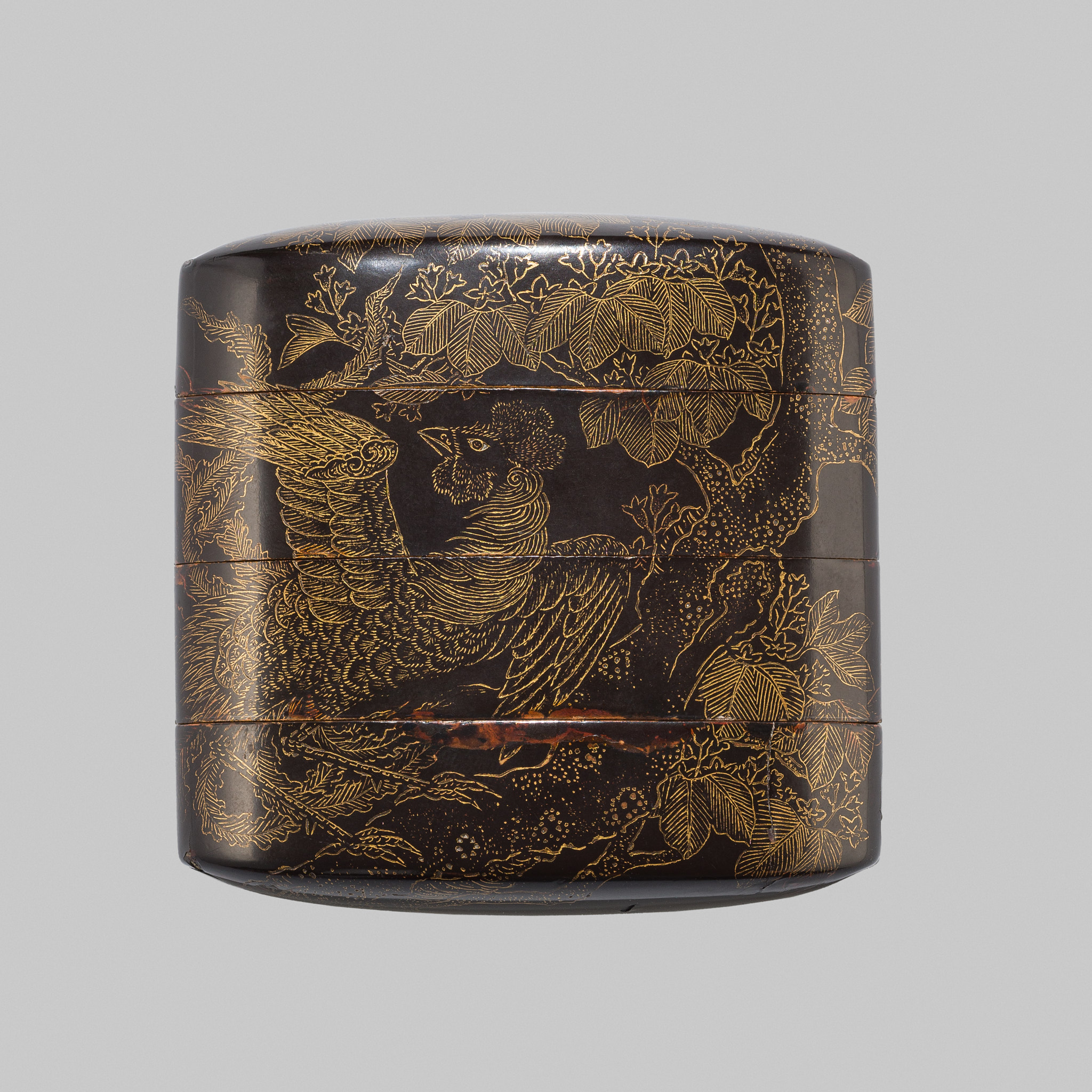 A BLACK LACQUER THREE-CASE INRO WITH A HO-O BIRD ON A KIRI TREE