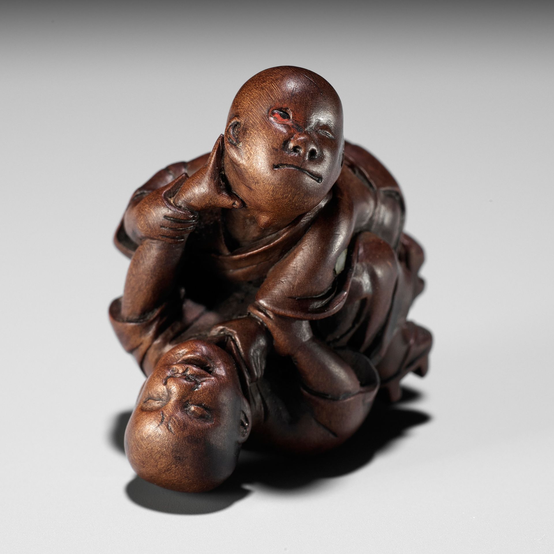 MIWA: A FINE WOOD NETSUKE OF TWO BLIND MEN FIGHTING