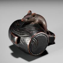 A WOOD NETSUKE OF A RAT ON DAIKOKU'S MALLET