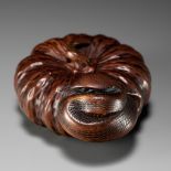 TADAKUNI: A FINE NAGOYA SCHOOL WOOD NETSUKE OF SNAKE WINDING THROUGH A PUMPKIN