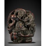 SADAKATA: A SUPERB WOOD NETSUKE OF RAKAN HANDAKA SONJA WITH DRAGON