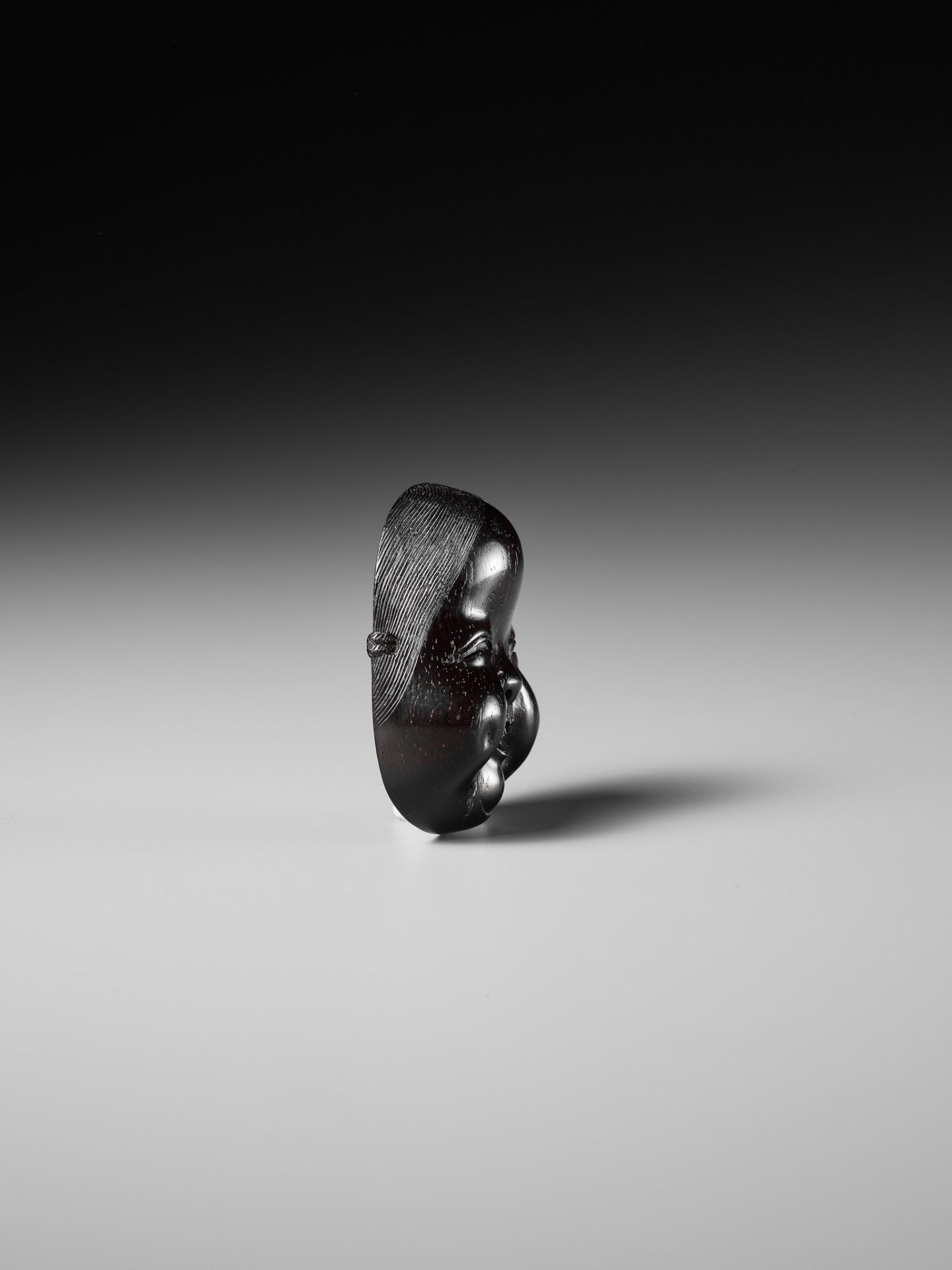 MEIKEISAI HOJITSU: A FINE DARK WOOD MASK NETSUKE OF OKAME - Image 8 of 13