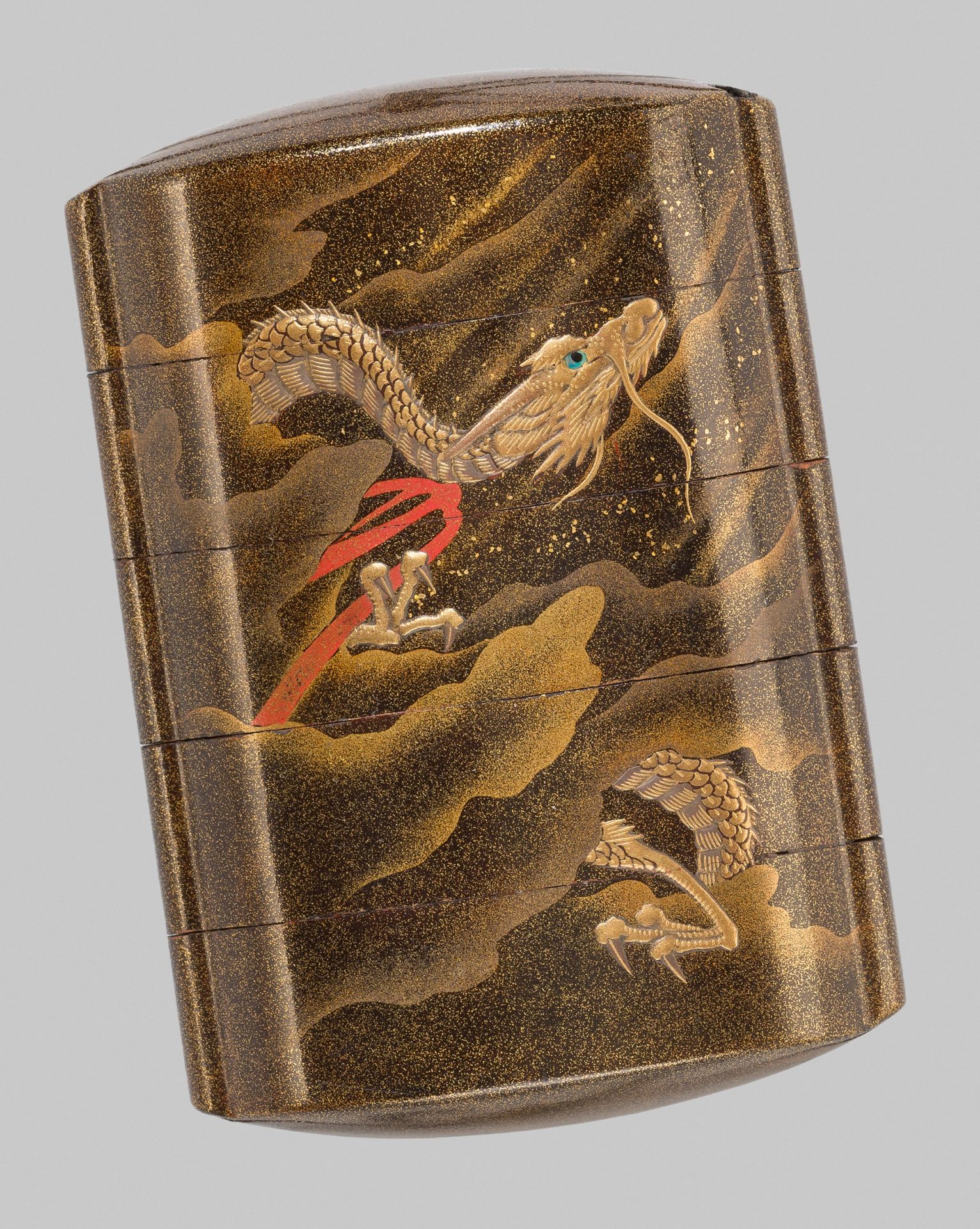 A FINE GOLD LACQUER FOUR-CASE INRO WITH A DRAGON AND MOUNT FUJI