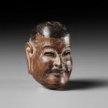 TETSURO: A LACQUERED WOOD GIGAKU MASK NETSUKE OF SHISHIKO