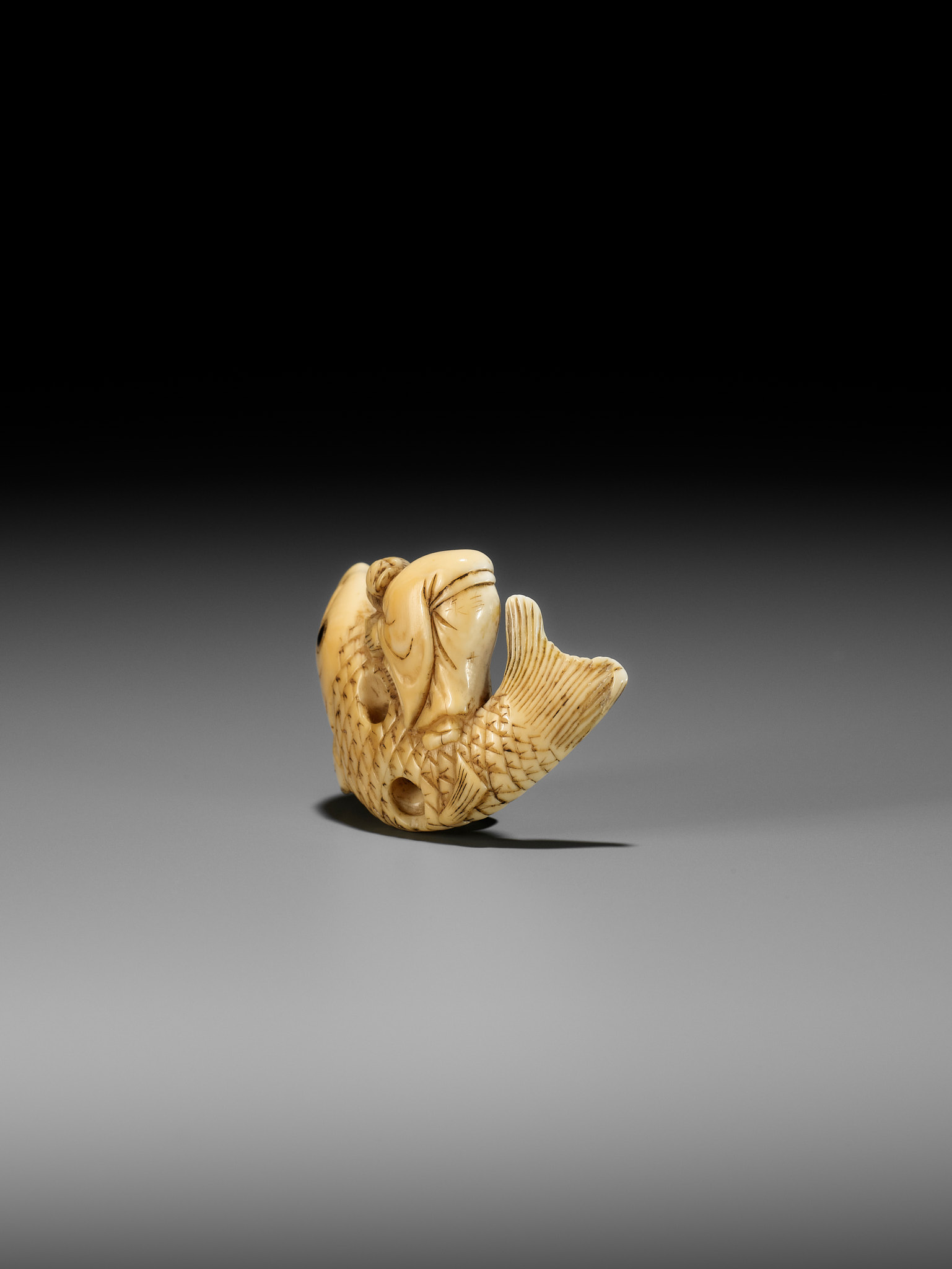 YOSHITSUGU: AN EARLY IVORY NETSUKE OF KINKO SENNIN ON A CARP - Image 10 of 14