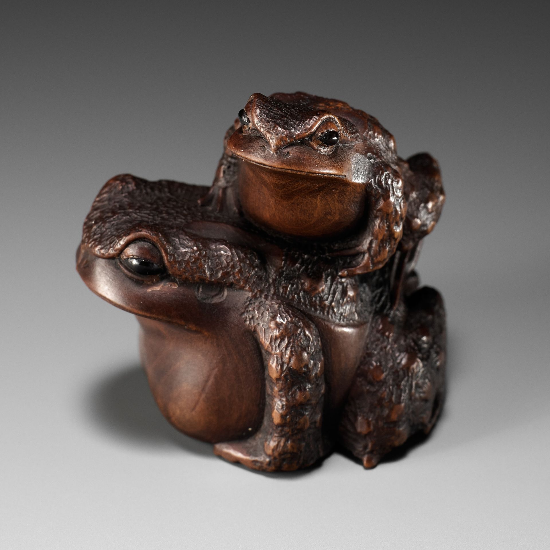 MASANAO: A FINE WOOD NETSUKE OF A TOAD WITH YOUNG