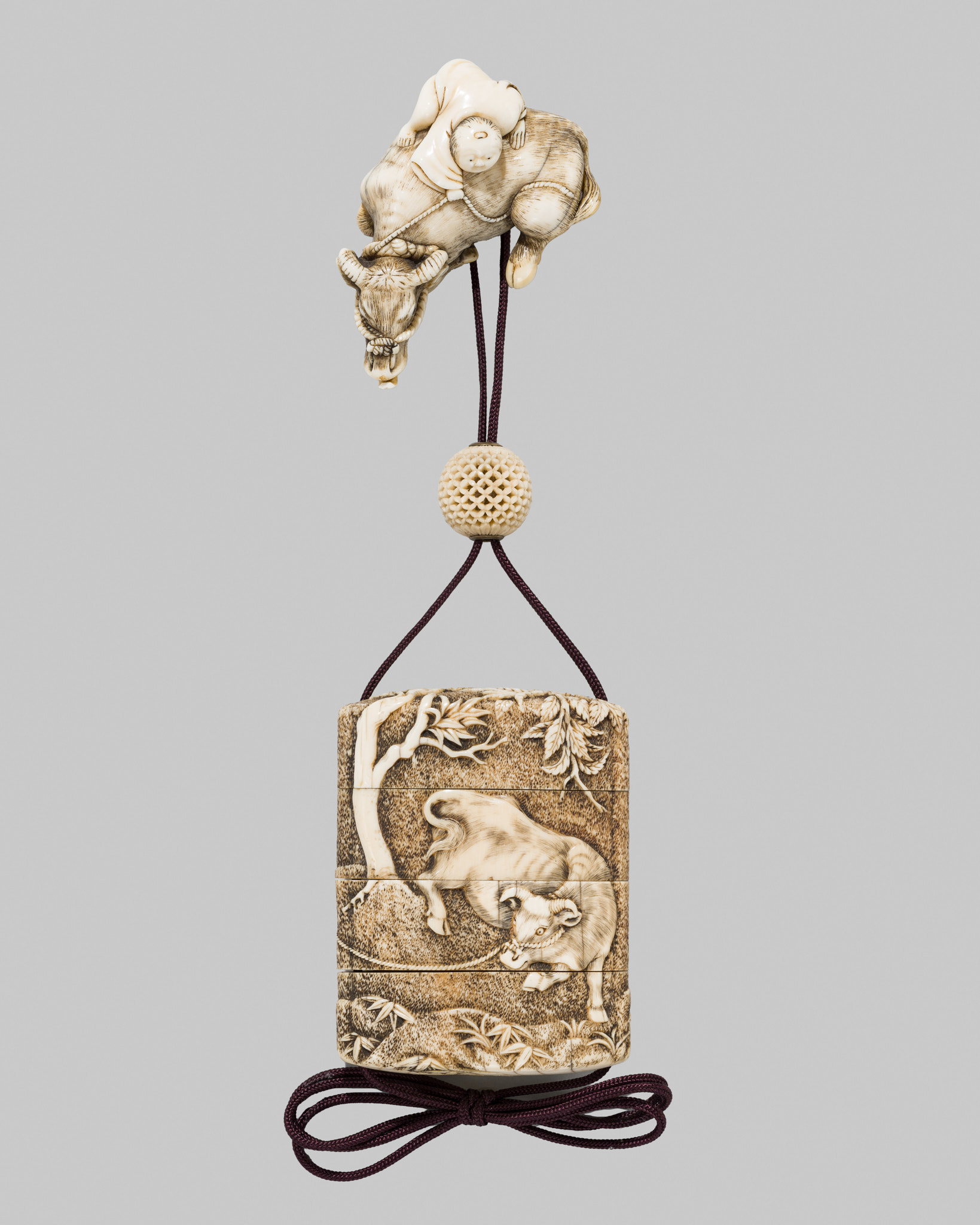 A RARE KYOTO SCHOOL IVORY THREE-CASE INRO WITH EN-SUITE NETSUKE BY GARAKU