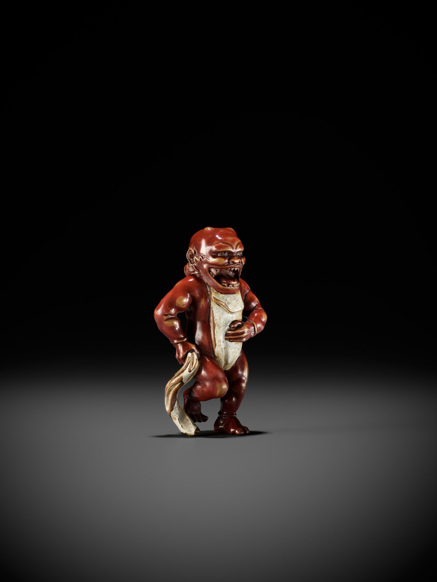 A RARE LACQUERED WOOD NETSUKE OF AN ONI TYING HIS FUNDOSHI - Image 11 of 12