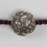 SHUGYOKU: A FINE SILVER OJIME DEPICTING A DRAGON