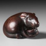 TOMOKAZU: A FINE WOOD NETSUKE OF A RAT EATING A CHESTNUT