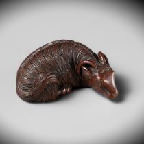 A FINE NAGOYA SCHOOL WOOD NETSUKE OF A RECLINING GOAT