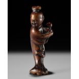 A WOOD NETSUKE OF KAKKYO'S WIFE AND CHILD