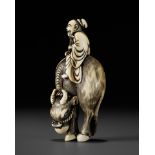 A FINE IVORY NETSUKE OF ROSHI ATOP AN OX