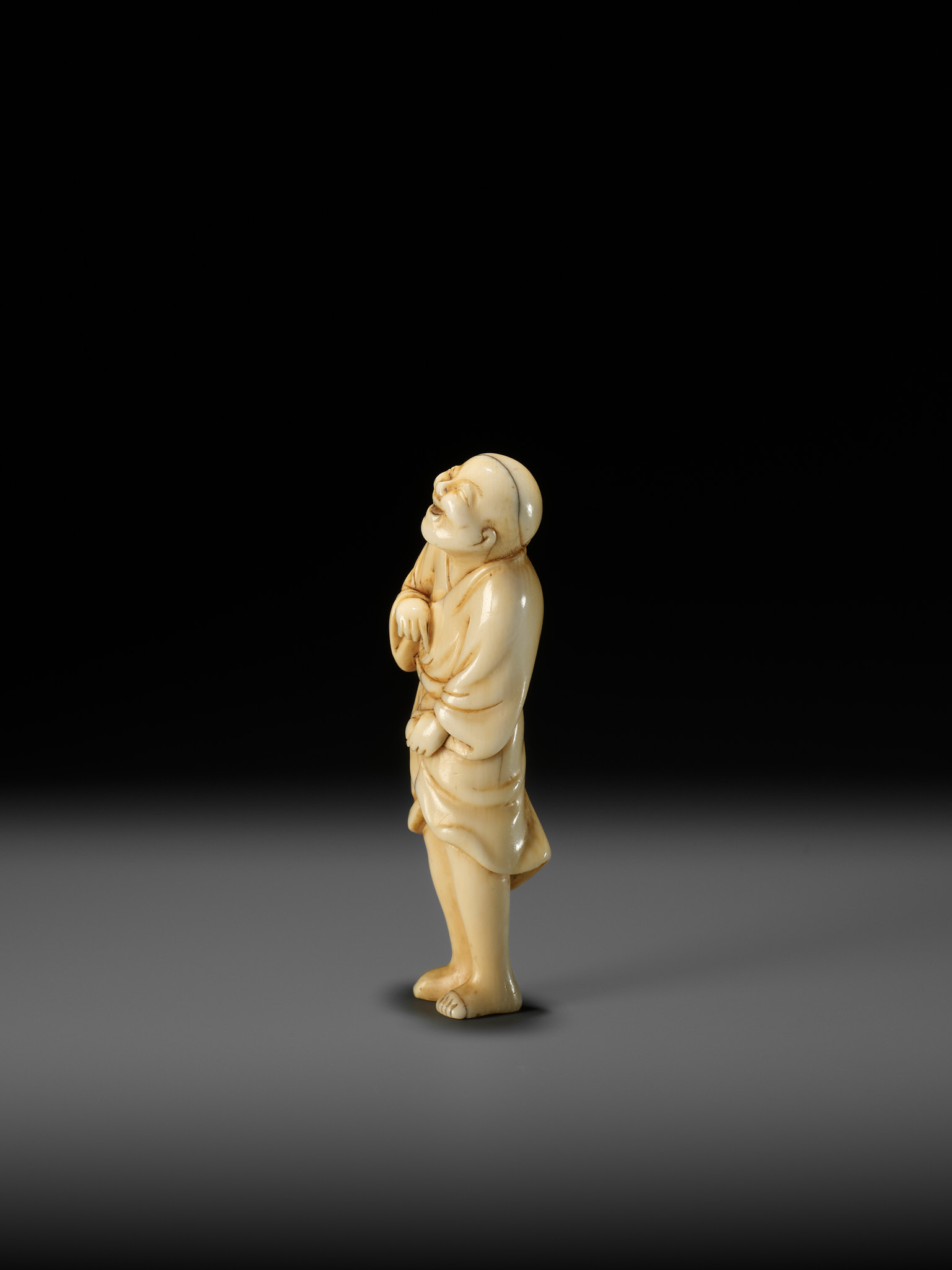 AN EARLY OSAKA SCHOOL IVORY NETSUKE OF A LAUGHING EGG-TESTER - Image 7 of 12