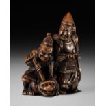 A FINE WOOD NETSUKE OF INO HAYATA AND MINAMOTO YORIMASA KILLING THE NUE