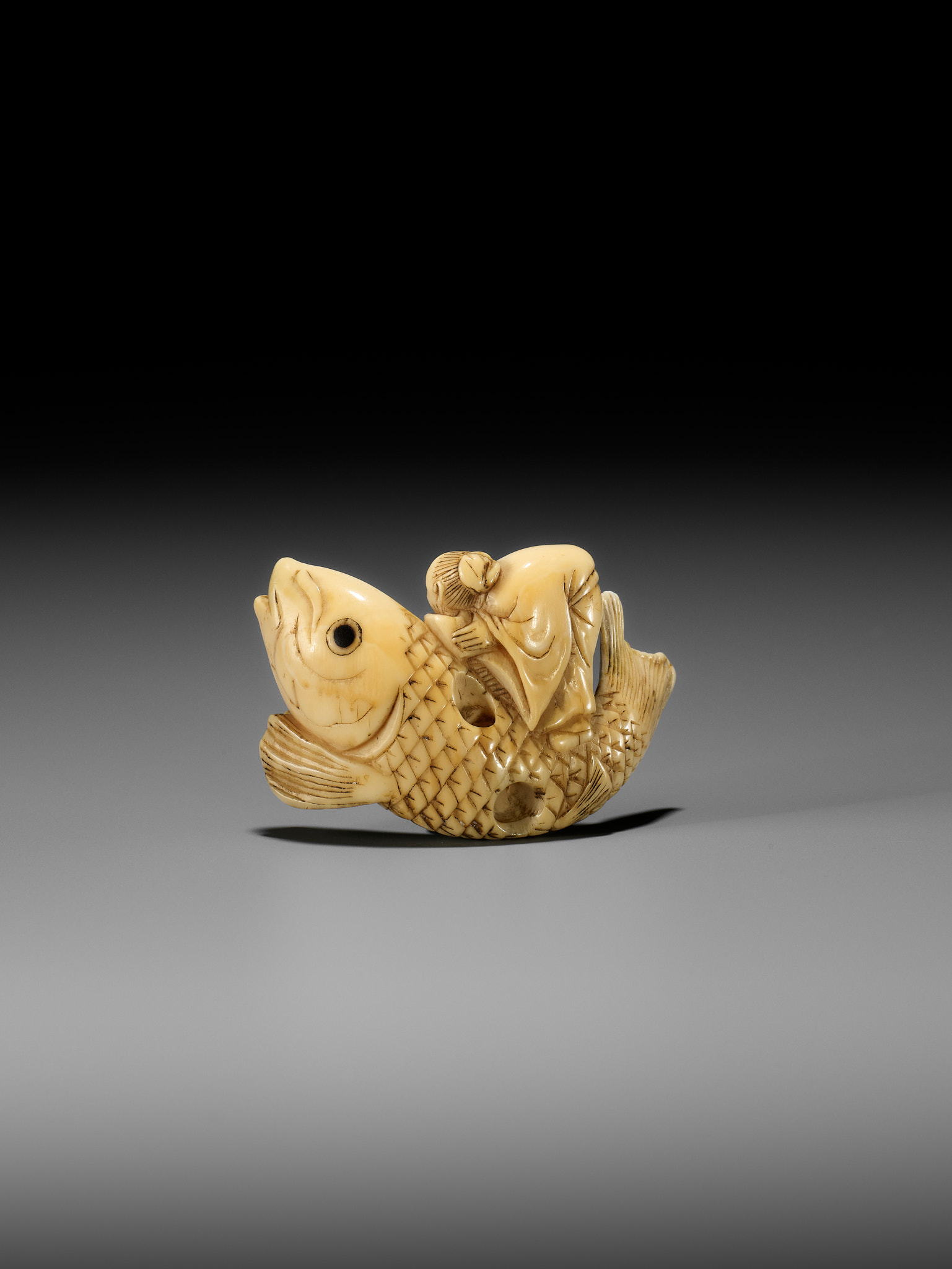 YOSHITSUGU: AN EARLY IVORY NETSUKE OF KINKO SENNIN ON A CARP - Image 5 of 14