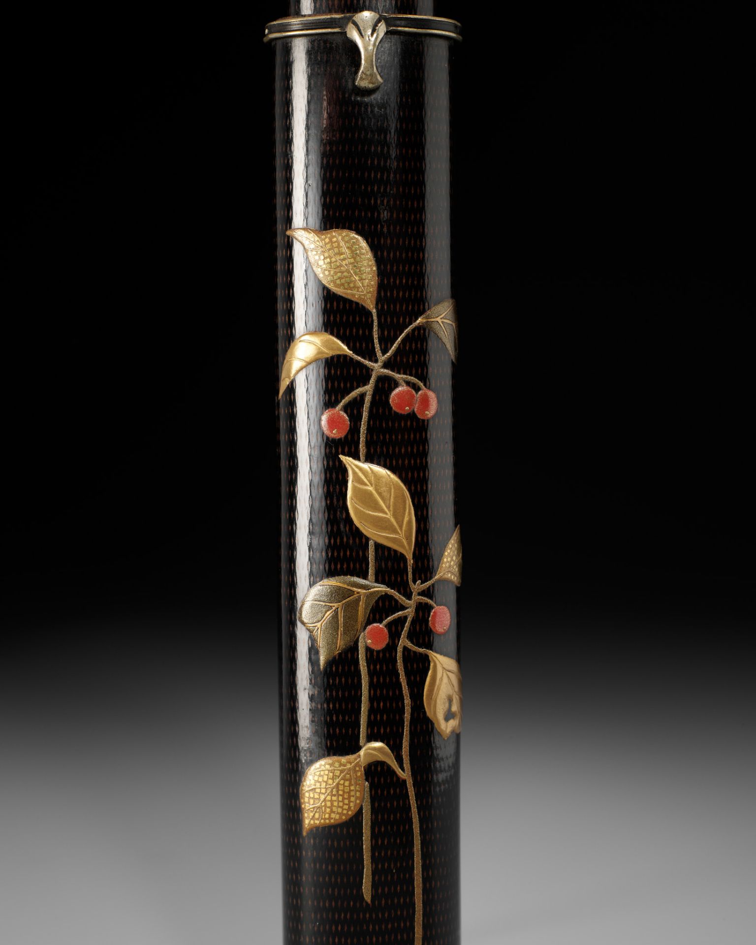 SHIRAYAMA SHOSAI: A RARE AND SUPERB BLACK LACQUER KISERUZUTSU DEPICTING NANDINA SPROUTS