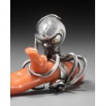 MINKOKU: A LARGE SILVER NETSUKE OF AN OCTOPUS GRASPING A PIECE OF CORAL