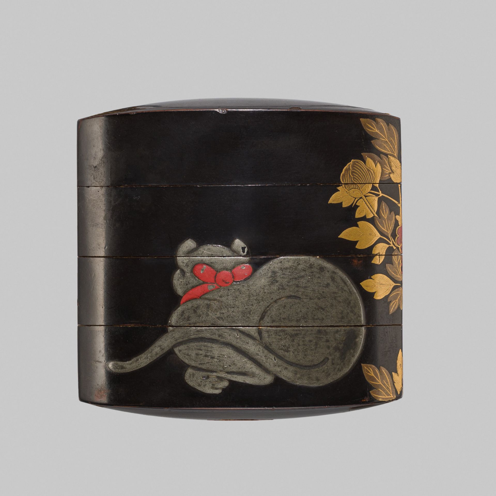 A BLACK LACQUER THREE-CASE INRO WITH A CAT AND BUTTERFLY