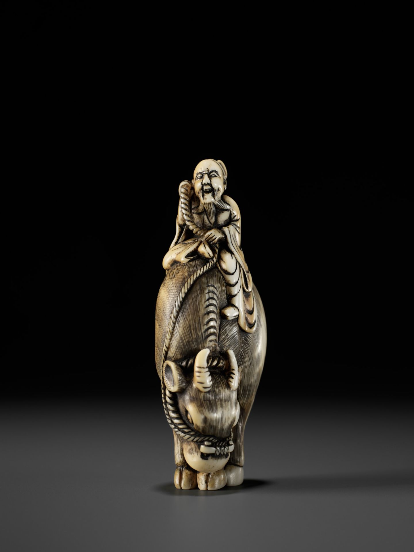 A FINE IVORY NETSUKE OF ROSHI ATOP AN OX - Image 2 of 12