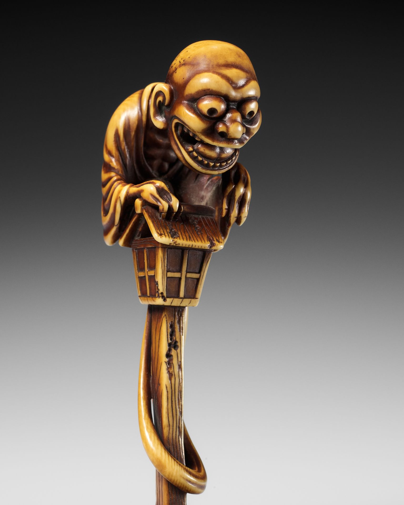 HIDEMASA: A SUPERB AND LARGE IVORY NETSUKE OF THE BAKEMONO MIKOSHI NYUDO