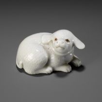 AN EXQUISITE HIRADO PORCELAIN NETSUKE OF A PUPPY