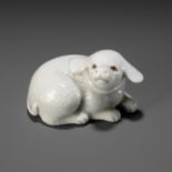 AN EXQUISITE HIRADO PORCELAIN NETSUKE OF A PUPPY