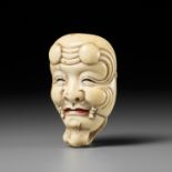 MEIKEISAI HOJITSU: A FINE IVORY MASK NETSUKE OF OKINA