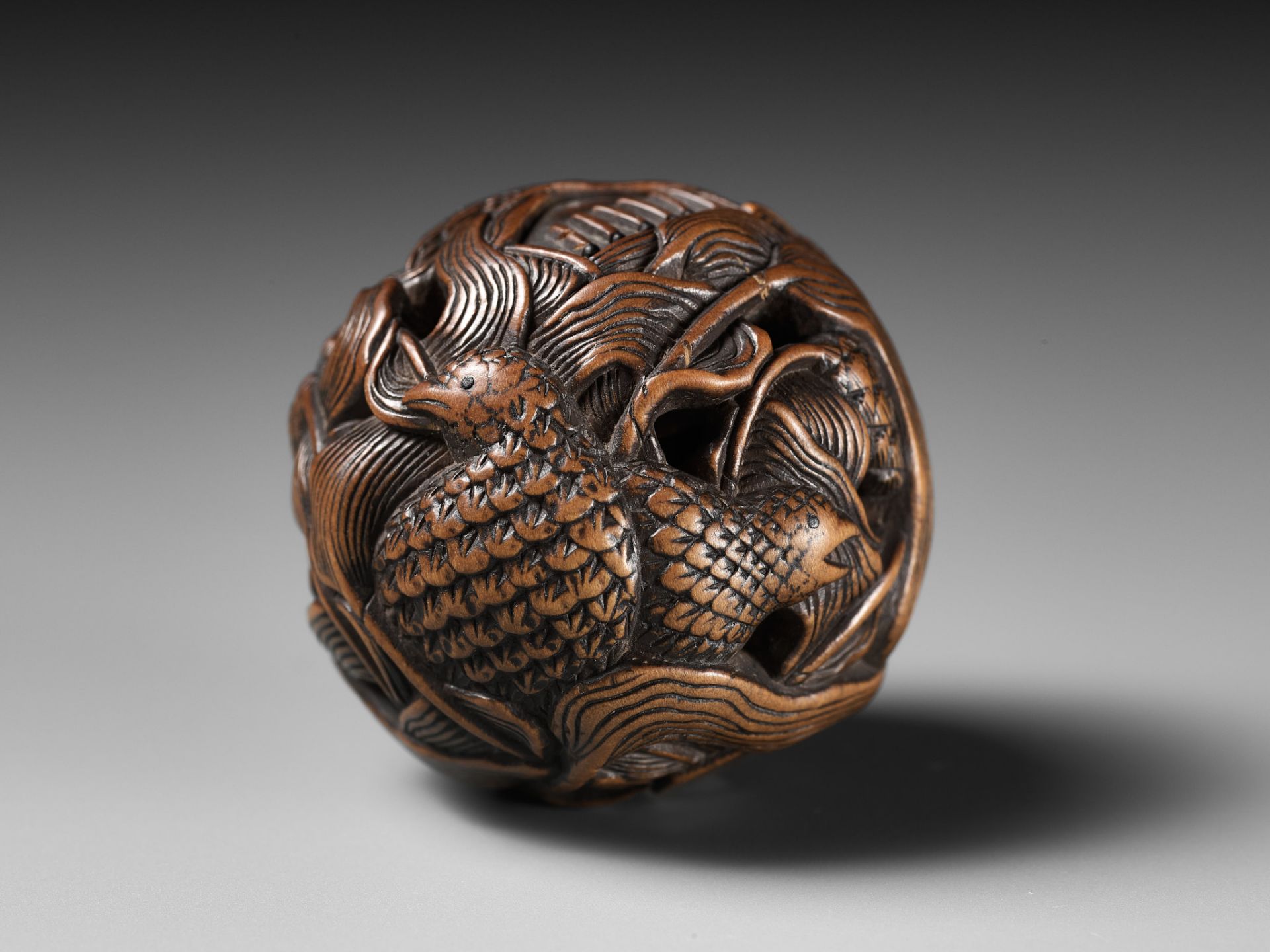 MASANAO: A FINE WOOD NETSUKE DEPICTING AN AUTUMNAL SCENE OF QUAILS AND MILLET - Image 2 of 14