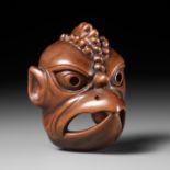 ITTOKUSAI: A SUPERB AND LARGE WOOD GIGAKU MASK NETSUKE OF KARURA (GARUDA)