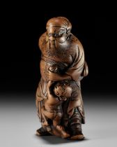 A FINE EARLY EDO SCHOOL WOOD NETSUKE OF SHOKI AND ONI