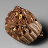 TADAKAZU: A FINE WOOD NETSUKE OF A WASP NEST WITH MOVABLE LARVAE