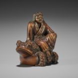 MASANAO: A RARE WOOD NETSUKE OF GAMA SENNIN SEATED ON THE FROG GOD SEIAJIN