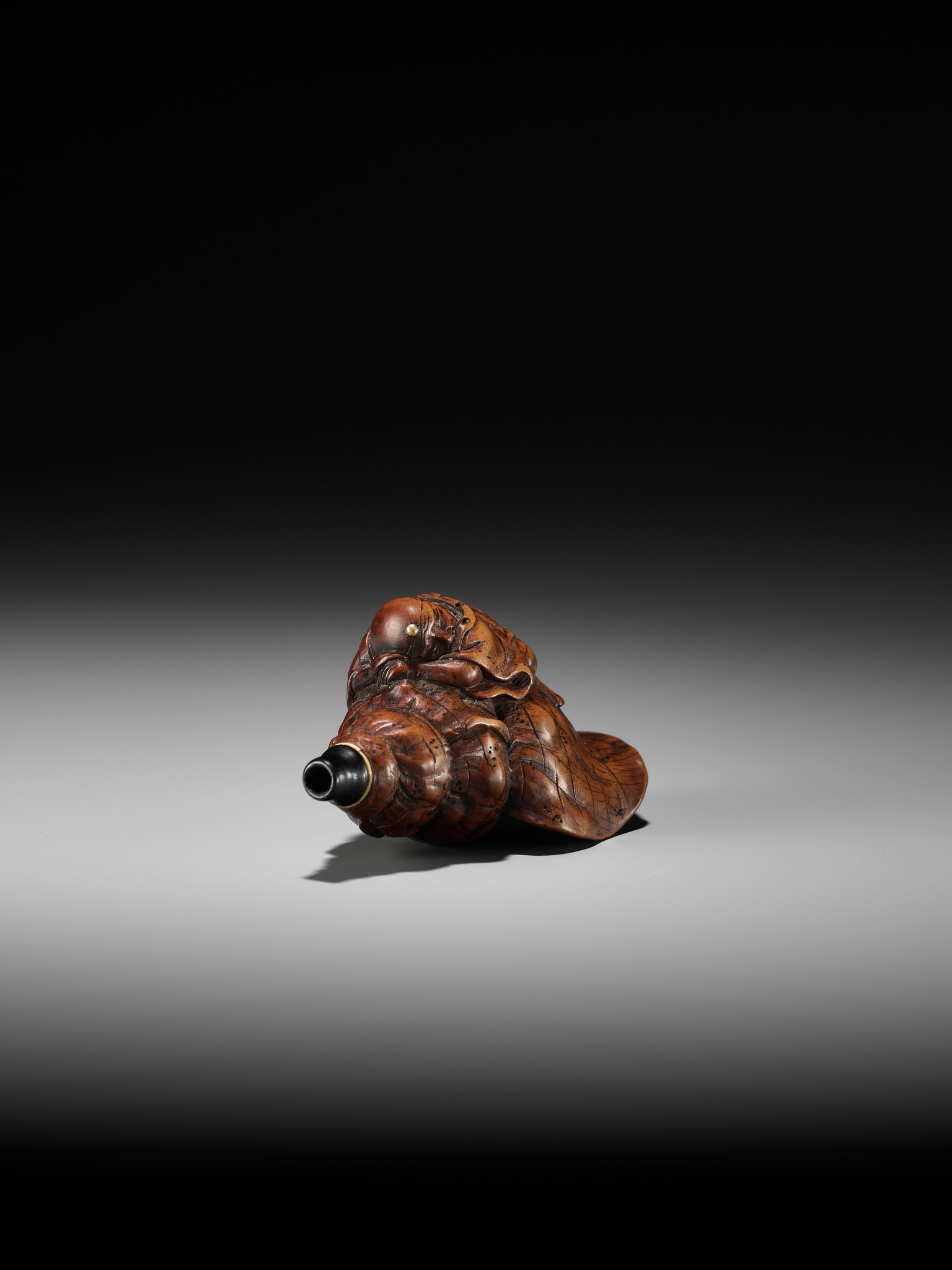 A WOOD NETSUKE OF BENKEI SLEEPING ON A CONCH (HORAGAI) - Image 9 of 10