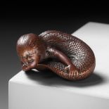 TADATOSHI: A SUPERB NAGOYA SCHOOL WOOD NETSUKE OF A NINGYO (MERMAID)