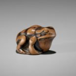 AN EARLY WOOD NETSUKE OF A TOAD