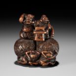 KAZUNORI: A LARGE WOOD NETSUKE OF DAIKOKU AND EBISU AT SETSUBUN