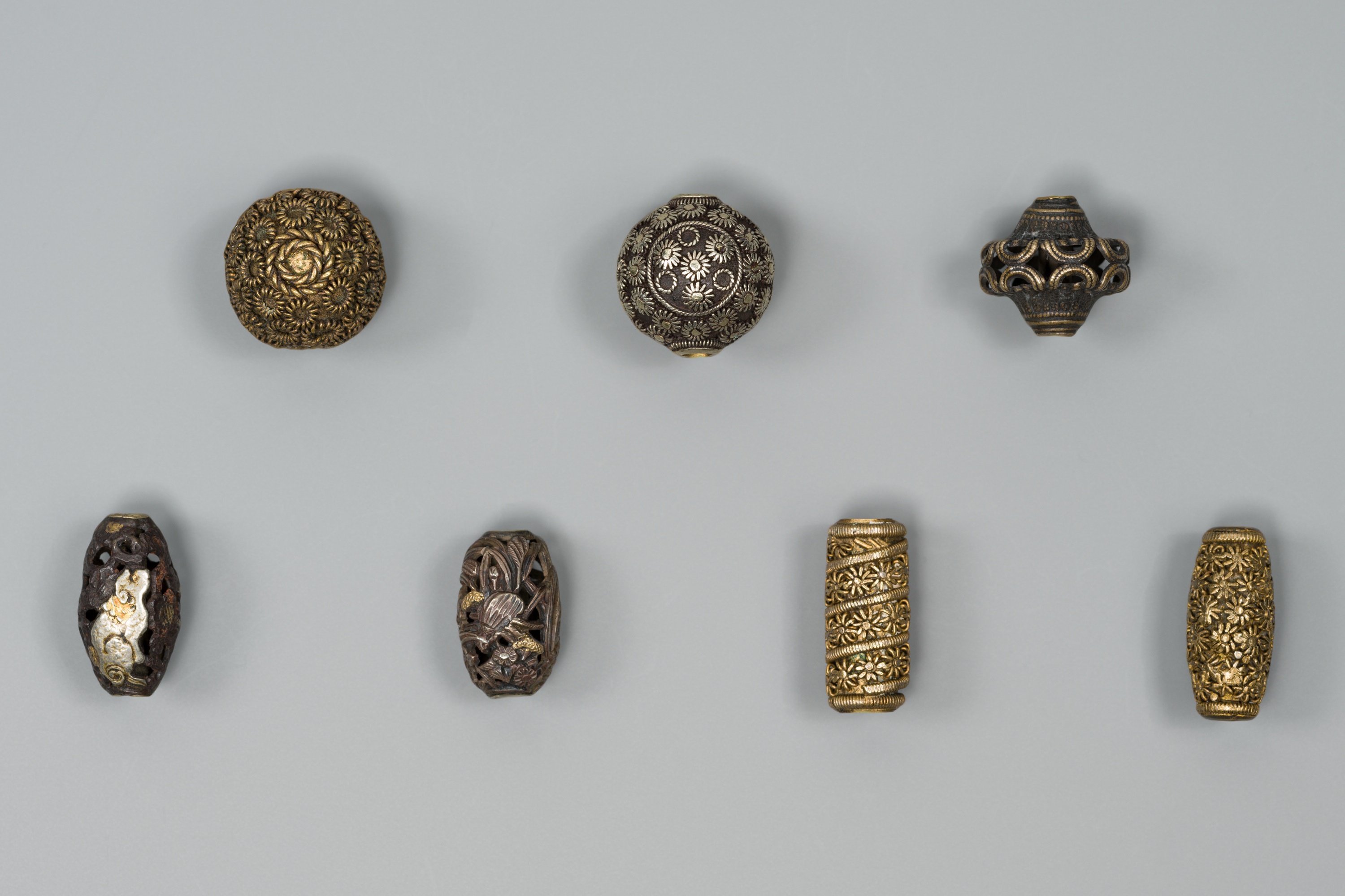 A GROUP OF SEVEN MIXED METAL OJIME